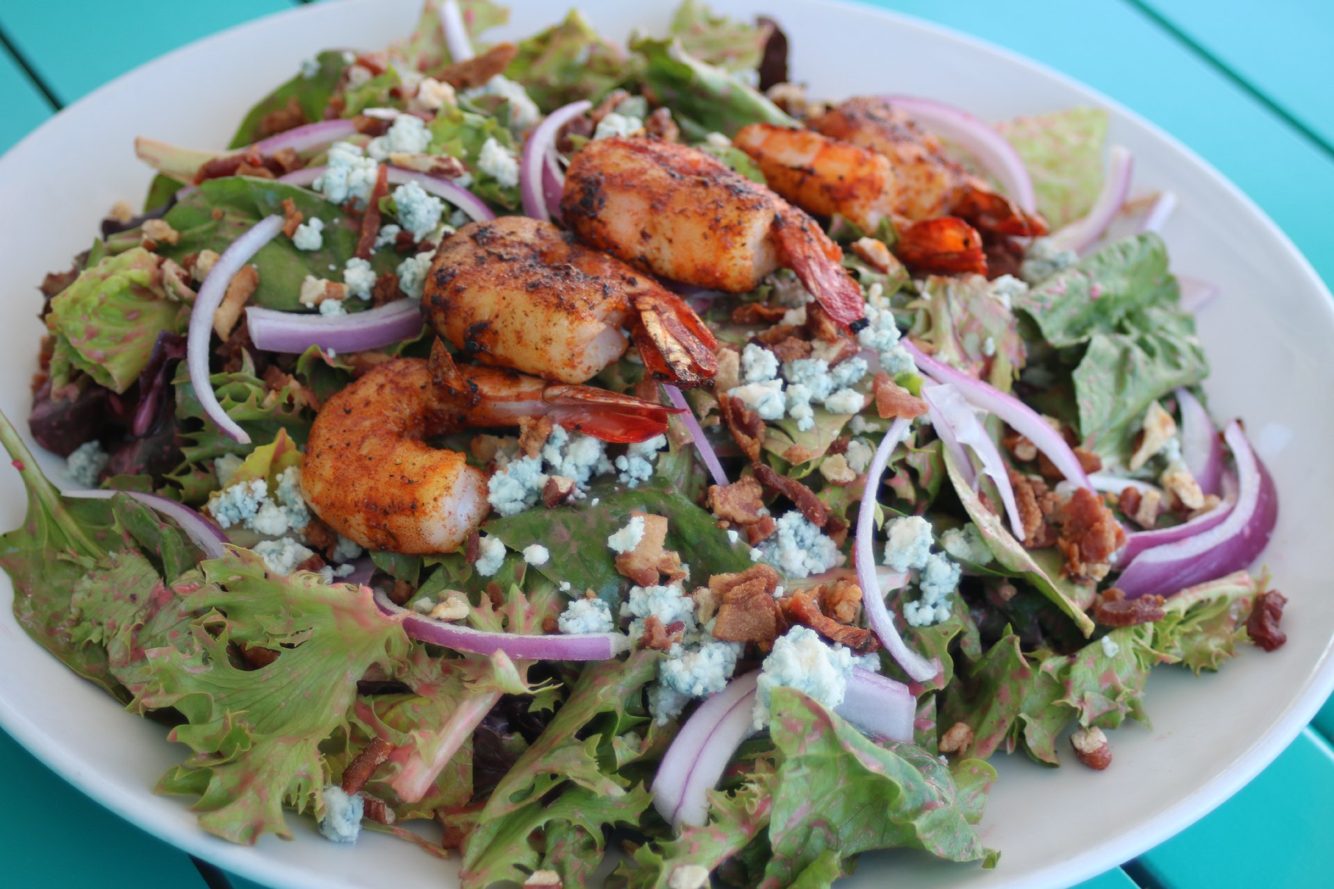 grilled shrimp over salad greens