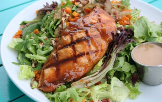 salmon over salad greens